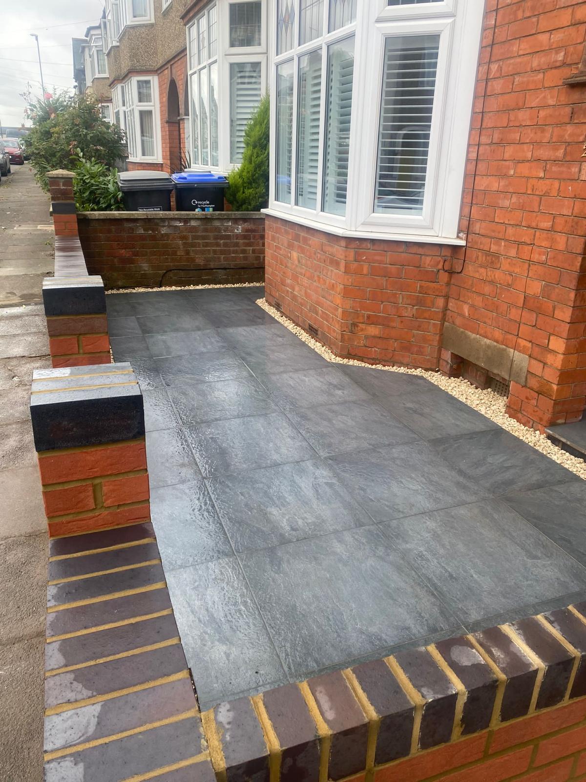 Completed dark front paving and brick edging