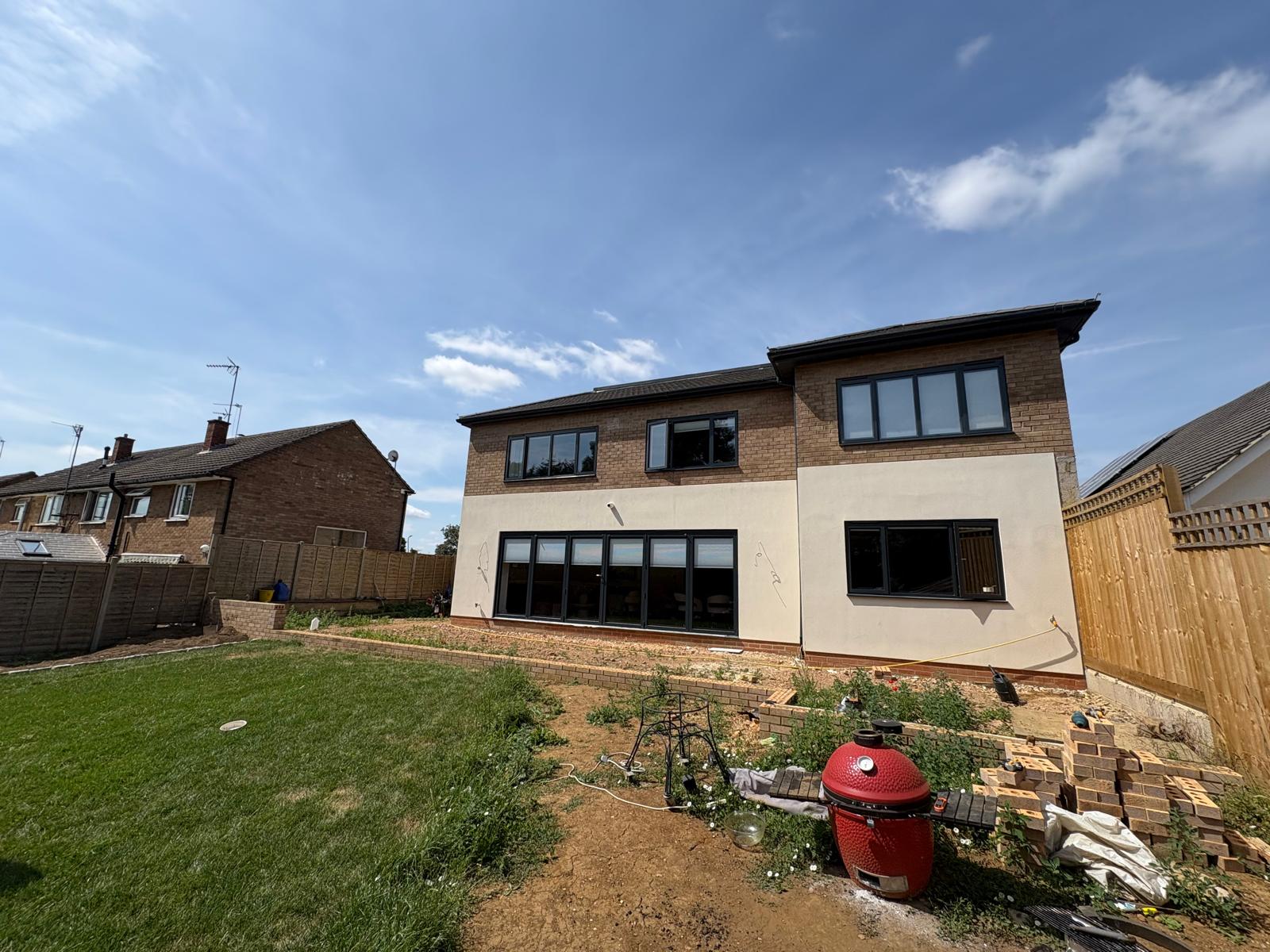 Rear garden and two-storey house before the surrounding ground was finished