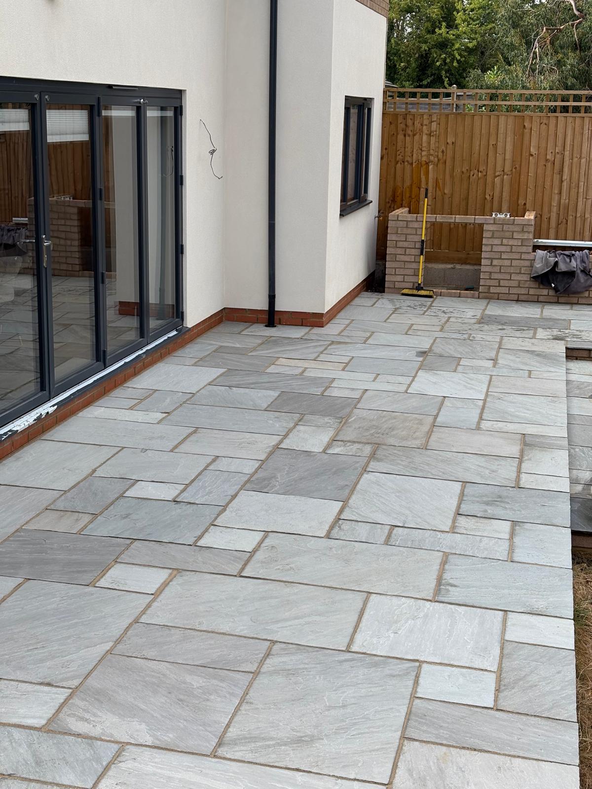 Detailed stone paving at the rear of a home