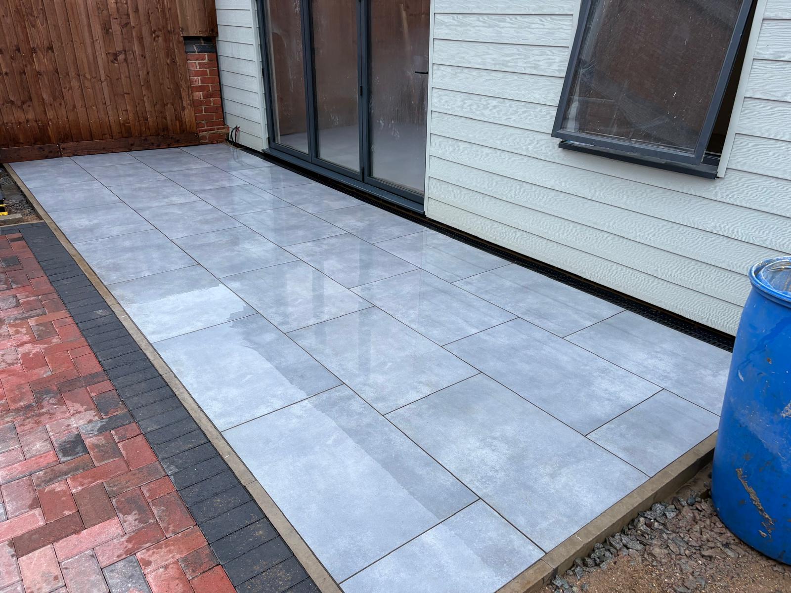 Detail of grey paving beside a garden room